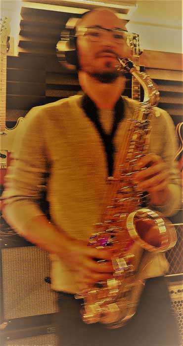 Tom Martin playing sax in the studio