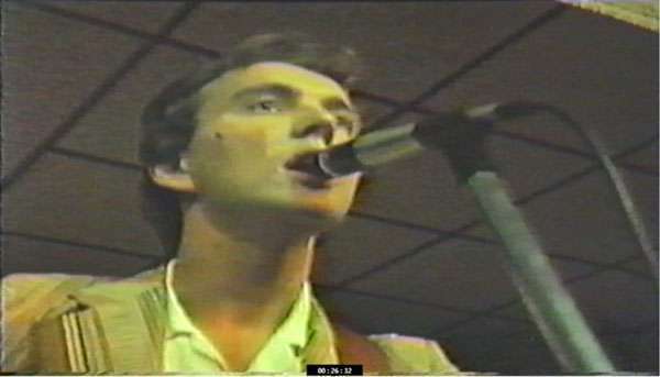 STEViE ZiPP singing into a microphone in the early years