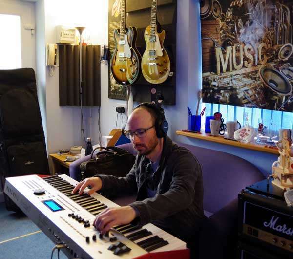 Tom-O-Martin playing a keyboard