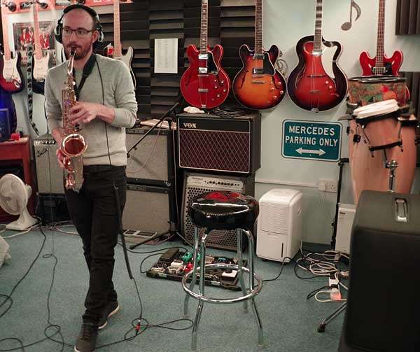 Tom-O-Martin playing a saxophone